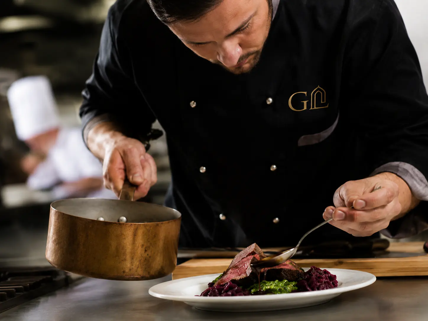 Private chef preparing dinner for GreenLuxe guests